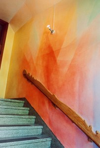 stairway with bold geometric mural